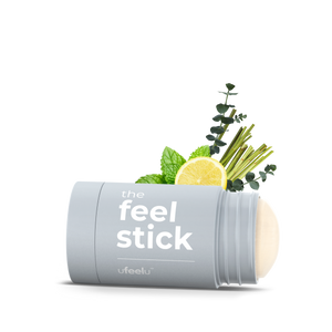 Product packaging labeled 'the feel stick' with natural elements on a white background