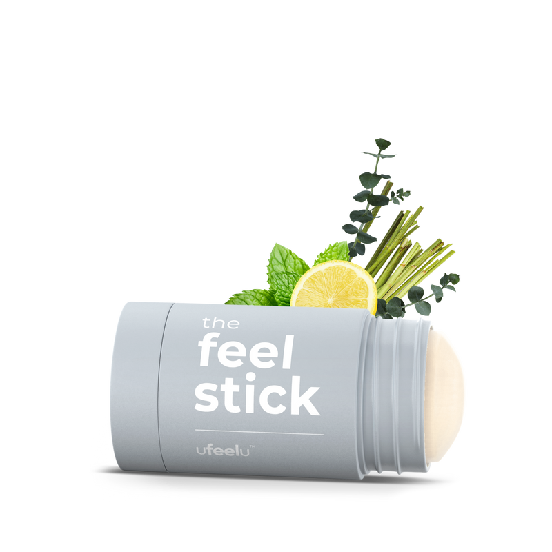 Product packaging labeled 'the feel stick' with natural elements on a white background