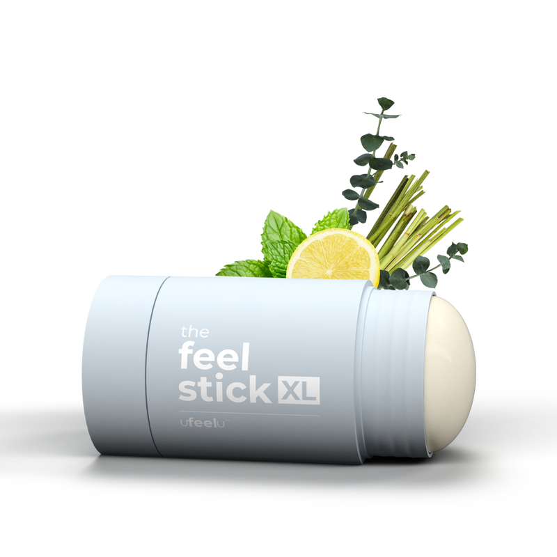 Feel Stick XL product with herbs and lemon on a white background
