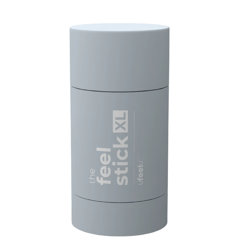 Gray cylindrical container labeled 'the feel stick XL' on a white background
