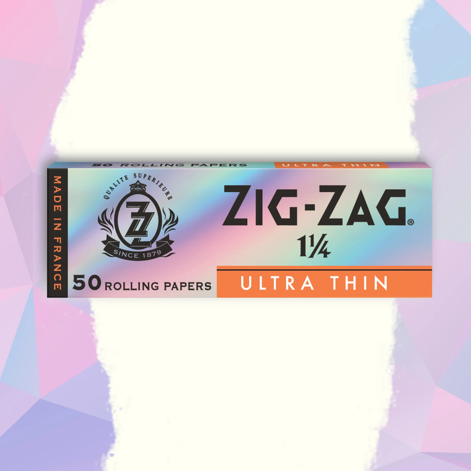 A pack of Zig-Zag 1 1/4 Ultra Thin Papers with a colorful, translucent design on a pink and purple background.