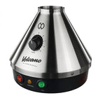 The image shows a Volcano Classic Vaporizer, which is a table-top vaporizing device with a metallic silver finish and a conical shape. It features a control knob on the front and three indicator lights in red, green, and yellow.