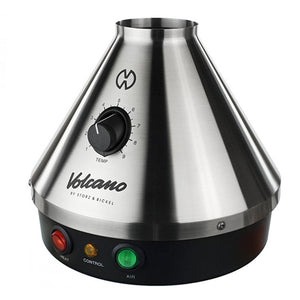 The image shows a Volcano Classic Vaporizer, which is a table-top vaporizing device with a metallic silver finish and a conical shape. It features a control knob on the front and three indicator lights in red, green, and yellow.