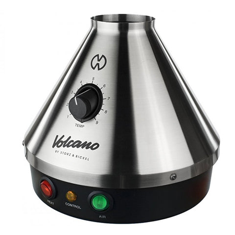 The image shows a Volcano Classic Vaporizer, which is a table-top vaporizing device with a metallic silver finish and a conical shape. It features a control knob on the front and three indicator lights in red, green, and yellow.