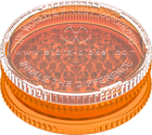 This is a grinder from Storz & Bickel made of orange plastic, pictured a side angle