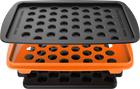 A set of accessories for filling dosing capsules, including a filling device, spatula, plunger, grinder, magazine with sealed capsules, and a scale. The grinder and magazine have orange accents.