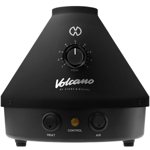 A black Volcano Classic vaporizer with a dial for temperature control and buttons for heat and air control.