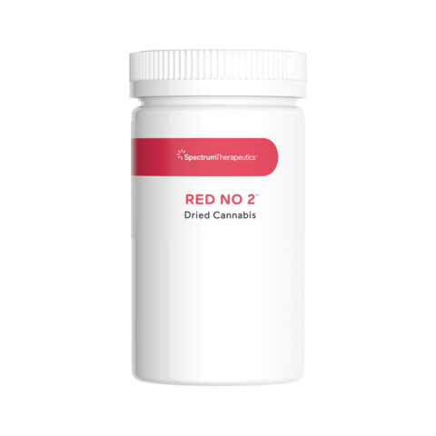 white bottle of cannabis packaging with red label