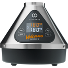 The image shows the Volcano Medic 2 hot air generator, which is a triangular-shaped device with a digital display, touch buttons, and ports for connecting accessories such as balloons and tubes.