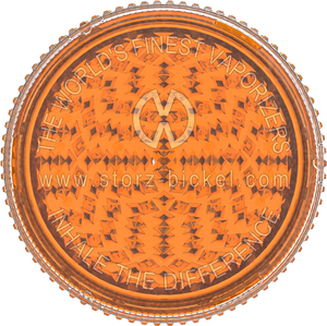 This is a grinder from Storz & Bickel made of orange plastic, pictured from the top down, as if looking directly at the top of the grinder.
