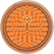This is a grinder from Storz & Bickel made of orange plastic, pictured from the top down, as if looking directly at the top of the grinder.