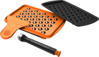 A set of accessories for filling dosing capsules, including a filling device, spatula, plunger, grinder, magazine with sealed capsules, and a scale. The grinder and magazine have orange accents.